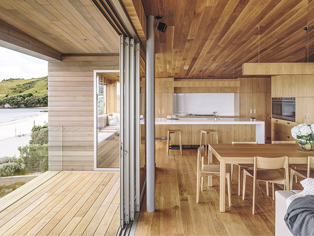oak kitchen with integrated fridge from fisher paykel - hahei house by studio2architects - self build - grand designs New Zealand home