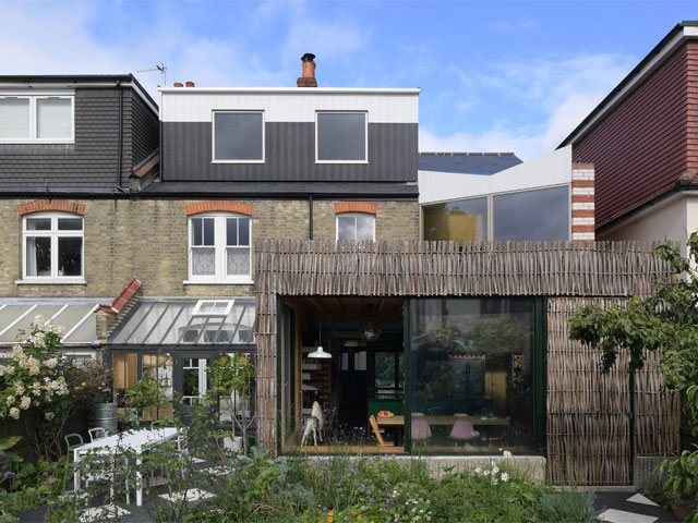 wraparound extension two storey with white patio furniture 