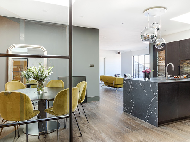 kitchen with glass partition and colour block zoning- grand designs 