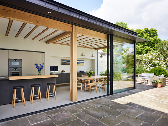 indoor outdoor kitchen extension with large glazing opening out onto garden