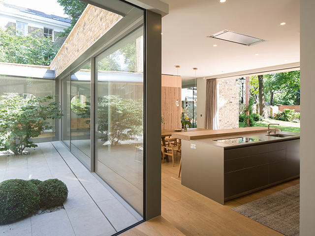 kitchen next to interior courtyard - grand designs self build 