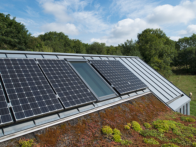 proctor shaw solar panels on green roof of house - grand designs
