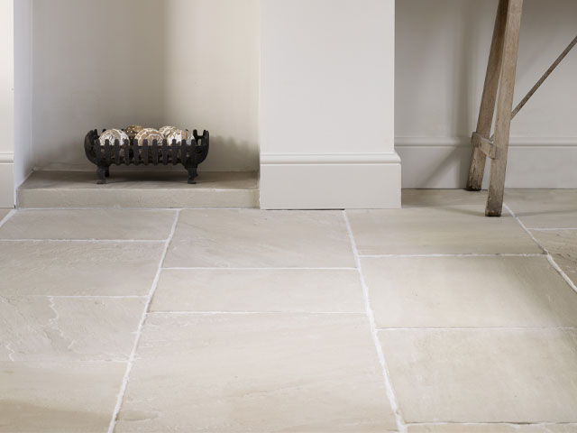 With tumbled edges and a textured surface, this design comes in varying lengths for a random pattern. Large worn ivory sandstone tiles, 50xfree lengthsx2cm, £75 per sqm, Floors of Stone