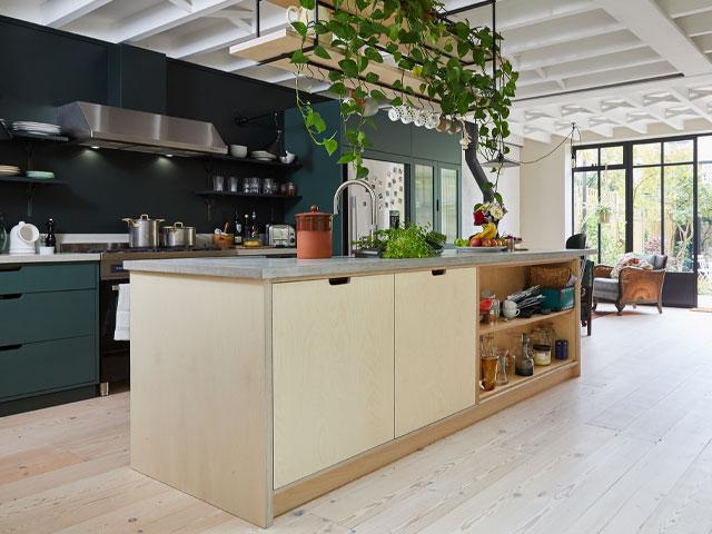 cabinets made from sustainable plywood with green walls and plants by The Main Company