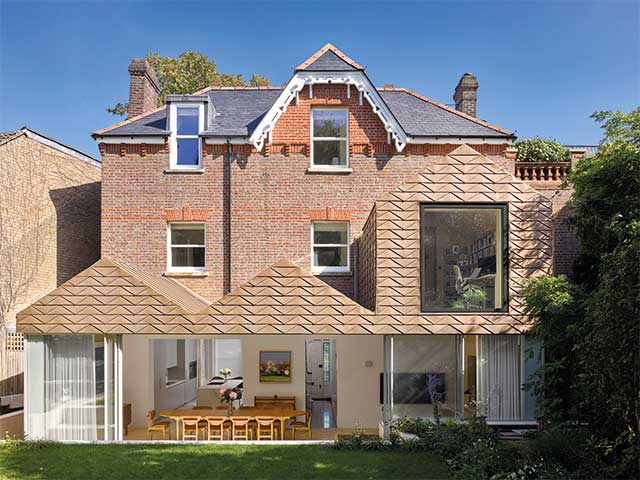 Folded bronze tiles on a house in Hampstead, London, by Dominic McKenzie Architects sustainable building materials