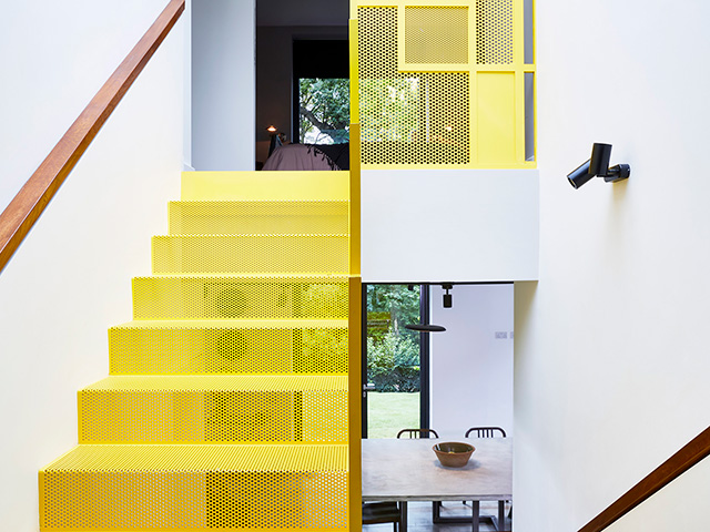 Grand designs TV house with yellow metal staircase 