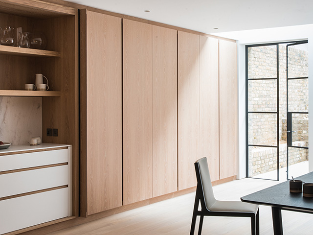 hidden kitchen pocket doors in oak - grand designs
