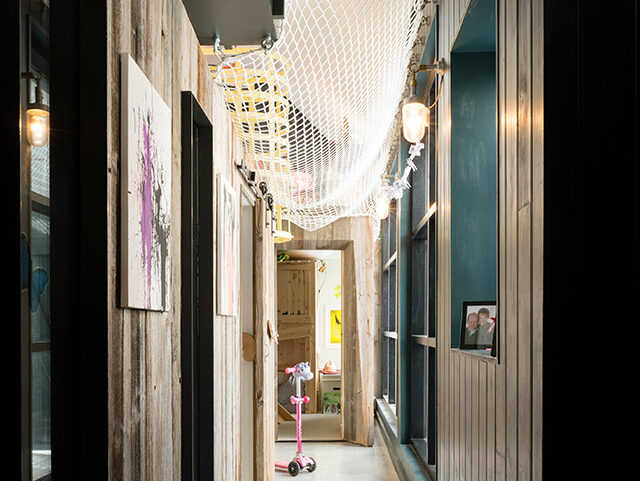 hallway with children's netting above - grand designs