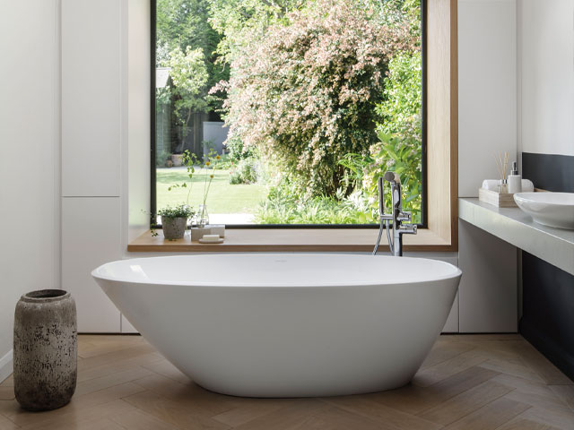 Rimless bath in a bathroom with picture window