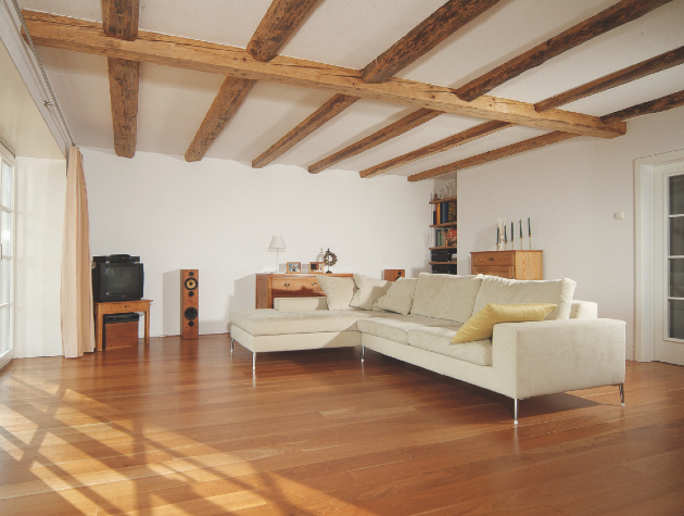 living room with wooden floor and ceiling beams