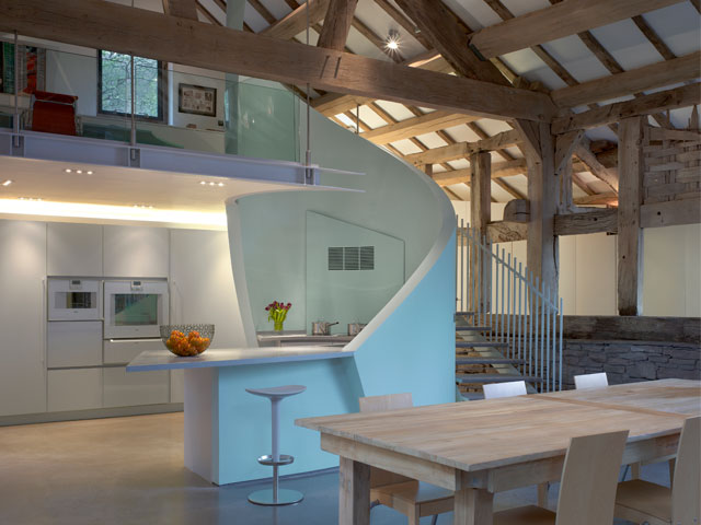 new kitchen in old property with beams and double-height vaulted ceilings