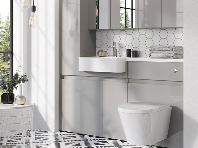 patterned bathroom floor tiles in a small bathroom with grey units