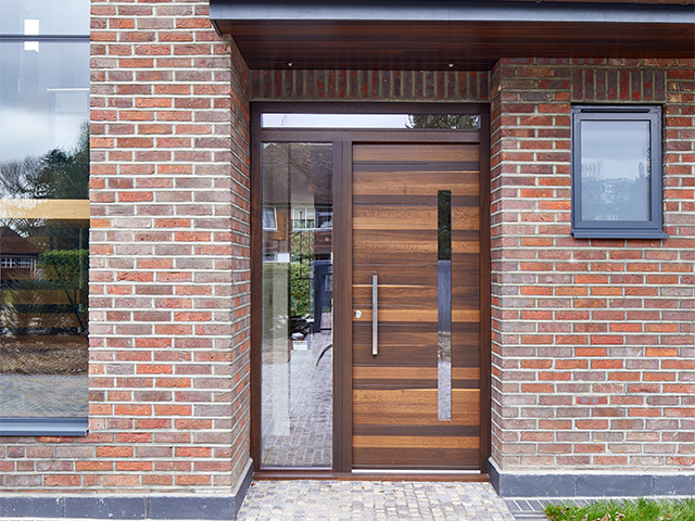 solid wood front door - how to create a grand entrance to your home - home improvements - granddesignsmagazine.com