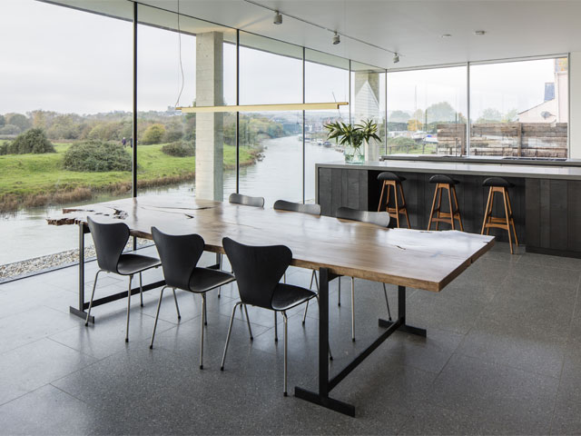 The living area has views of the river