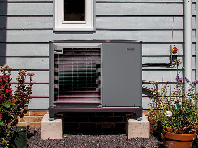 Nu Heat NIBE Air Source Heat Pump on exterior of home - grand designs - green homes grant