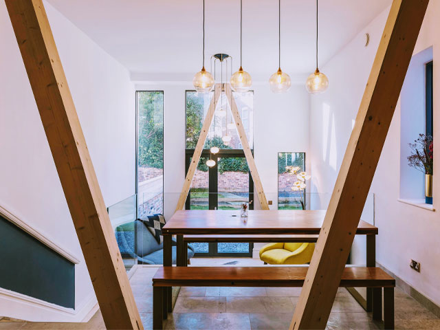 V-shaped timber beams in an Enerphit Passivhaus retrofit living room