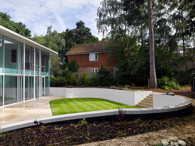 Bromley modernist house in Keston Park surrounded by trees. Grand Designs Paul and Penny