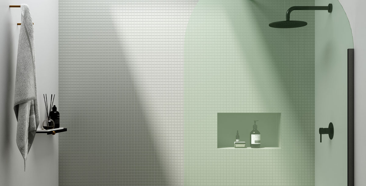 wet room with green mosaic tiles with curved shower panel by Ex-t