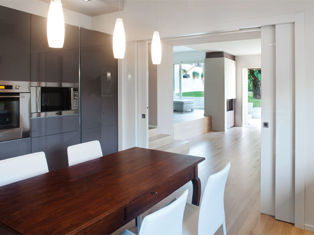 open plan kitchen and living room with sliding pocket doors as partition