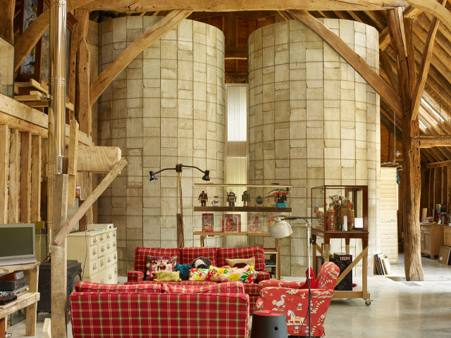 The interior of the barn conversion is chiefly open-plan, making the most of the huge timber-framed structure