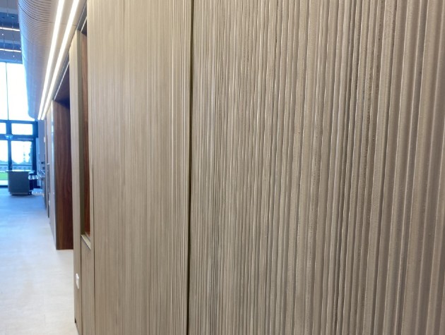 Vertical grooves textured Ultra High Performance Concrete wall with windows 1 copy