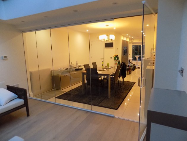 glass doors leading to dining area and kitchen