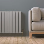 modern panel radiator next to cream coloured sofa