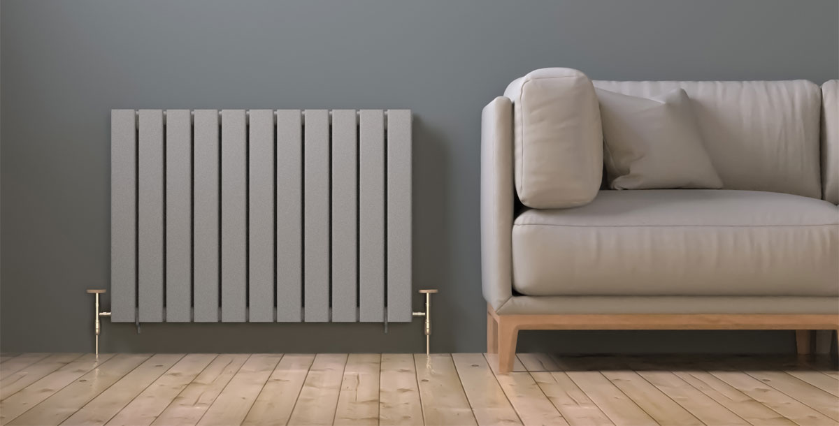modern panel radiator next to cream coloured sofa