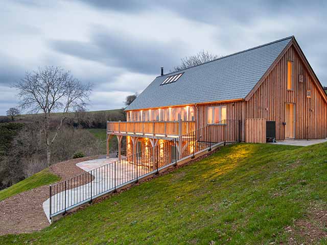 large oak wrap-around balcony by Roderick James