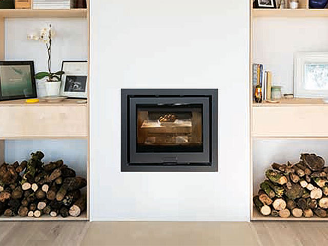 A-centrally-positioned-inset-log-burner-provides-a-focal-point-for-the-living-room-Photo-Jefferson-Smith-640