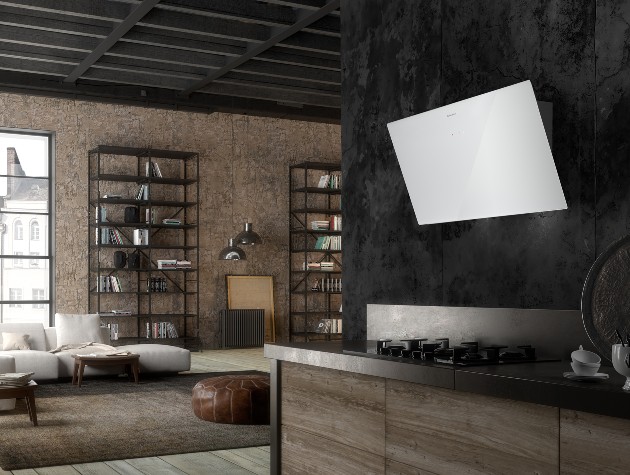 Open plan contemporary kitchen in dark wood and metal finishes with white Faber Tweet angled glass wall mounted cooker hood