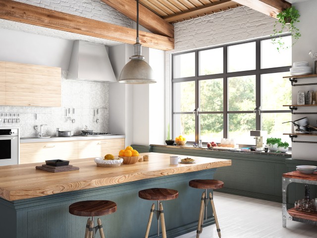 Contemporary kitchen in beamed room with industrial-style black Sheerline classic aluminium windows