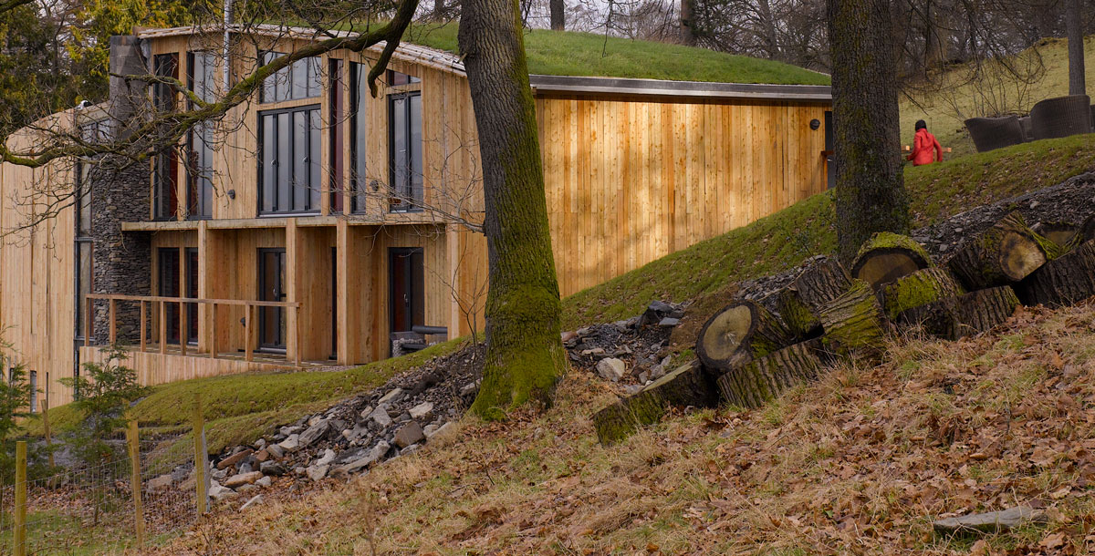 Exterior of the Grand Designs Lake District house on a hillside next to a woodland area