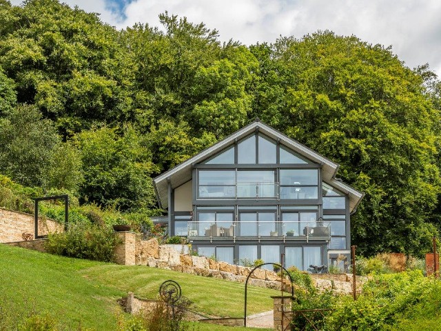 modern eco build in the countryside with completely glazed front