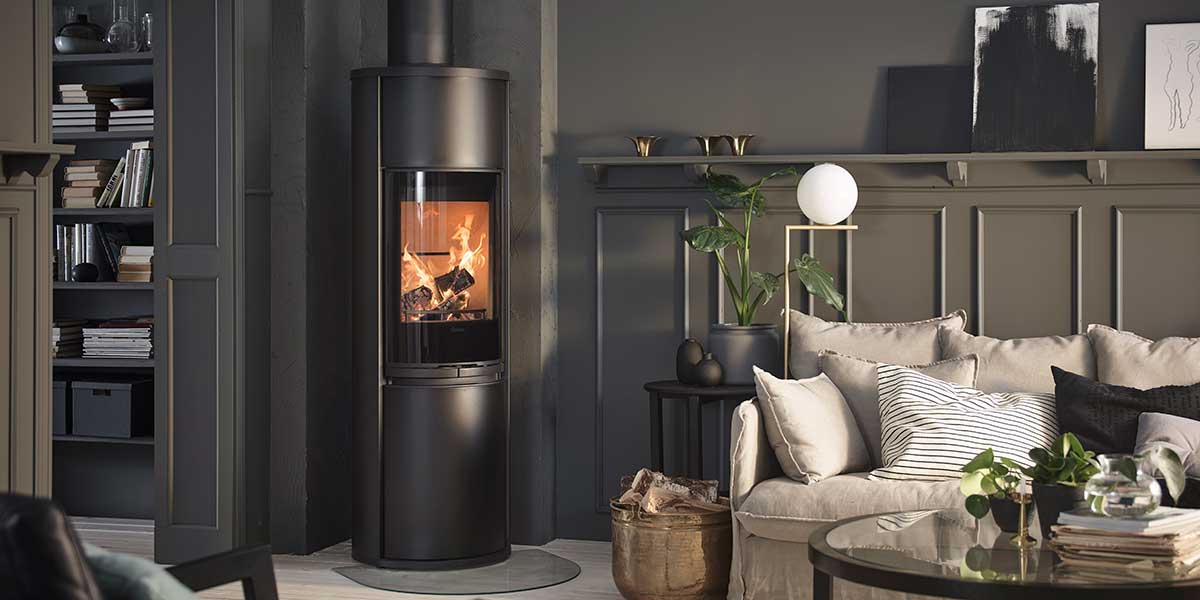 Wood burning stove in living room with cream sofa