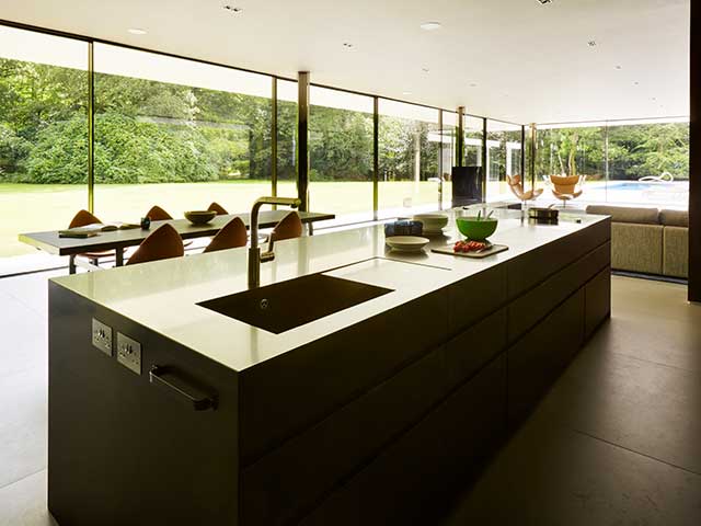 Kitchen island with gold taps and beautiful views of surrounding countryside