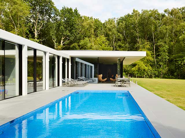 Outdoor swimming pool on courtyard of Grand Designs West Sussex home