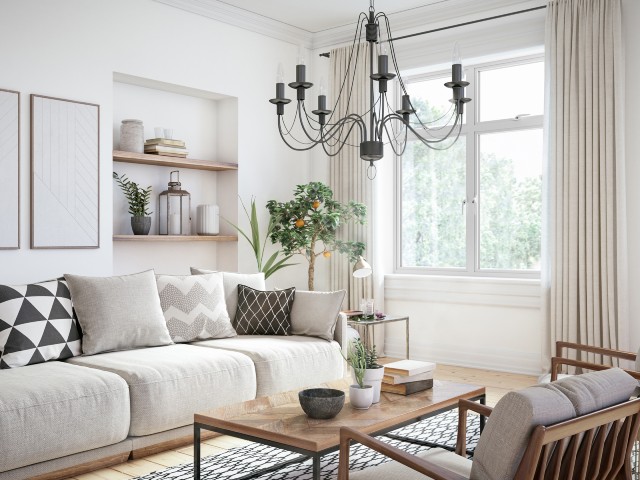 Contemporary-living-room-with-white-walls-and-neutral-sofa-monochrome-cushions-black-chandelier-and-white-Sheerline-aluminium-windows