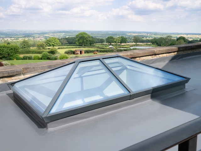 Exterior of a flat contemporary roof with an aluminium roof lantern