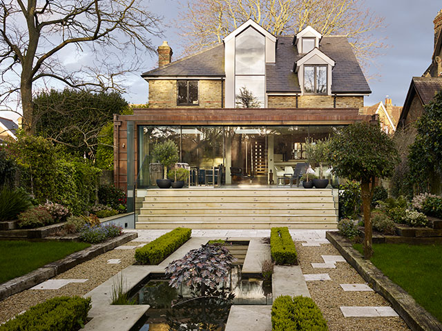 hiring an architect to build a house means you can have a modern glass extensions and landscaped gardens like this