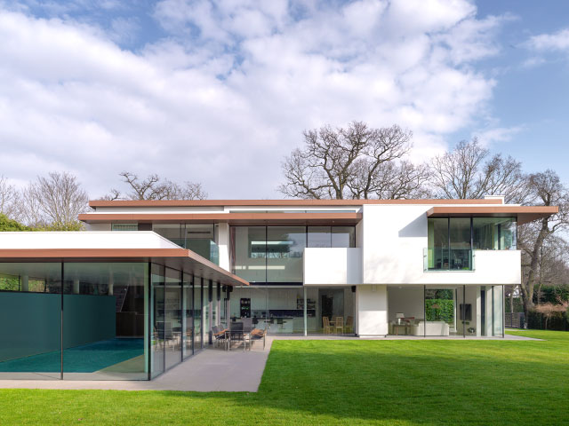 modern design home with glass walls and flat roof by 3s architects in Richmond