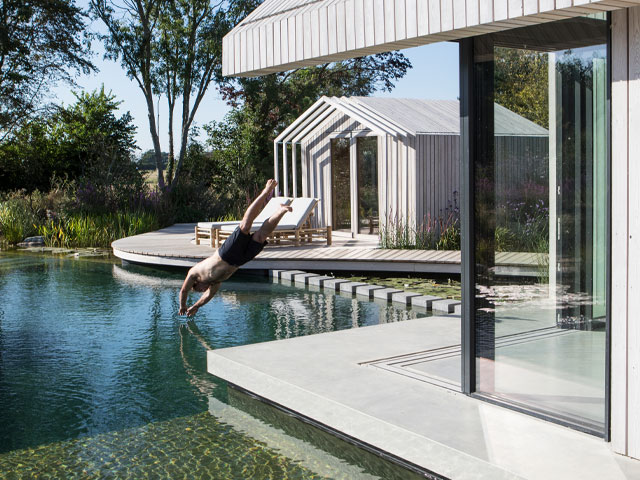 Dan from Grand Designs jumps into his swimming pond in West Sussex