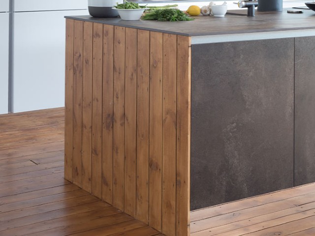 get the industrial kitchen look by using contrasting materials like wood and slate
