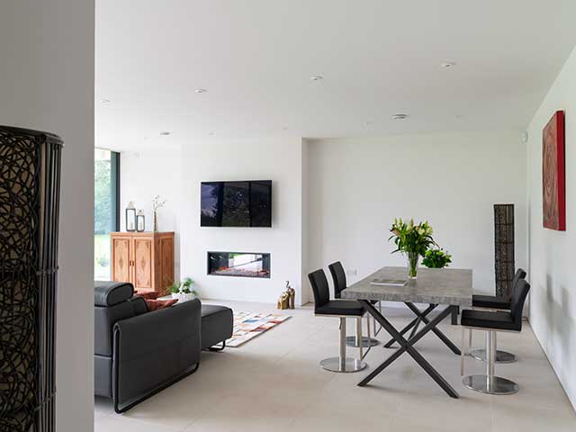 Living room with dining table and chairs in Grand Designs Malaysian pavilion