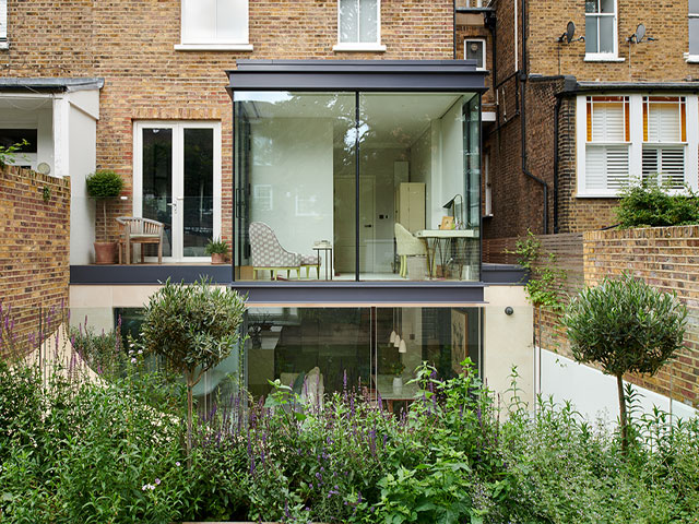 rear of terraced house with glass extension by 3s architects in Richmond