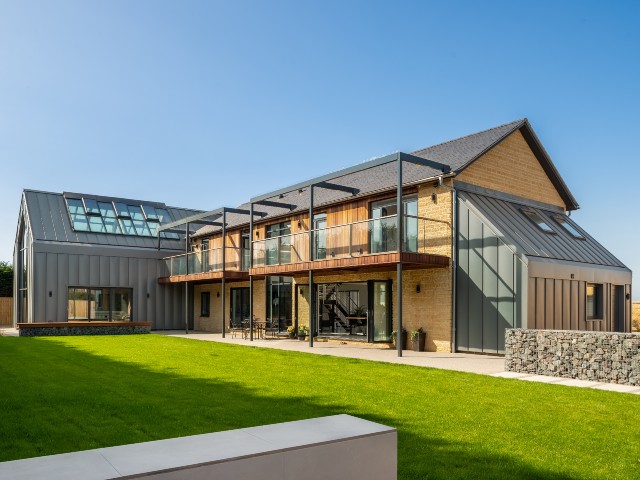 eco home design: modern self build with steel and timber cladding and maximum solar gains