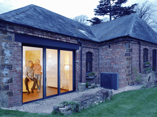 air source heat pump retrofitted into an older property with retired couple cosy indoors