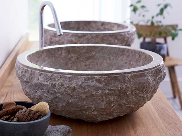 Scrula grey marble washbasin on wooden countertop 
