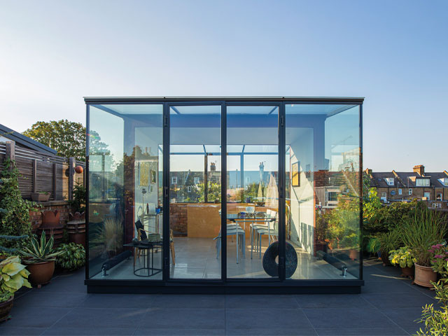 roof extension ideas: glass box roof extension with terrace in london