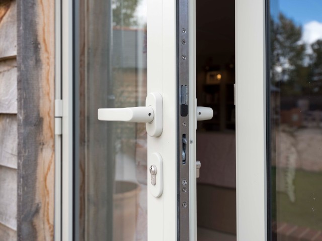 secure bi-fold doors with multi-point locks and high-grade hinge on a modern home